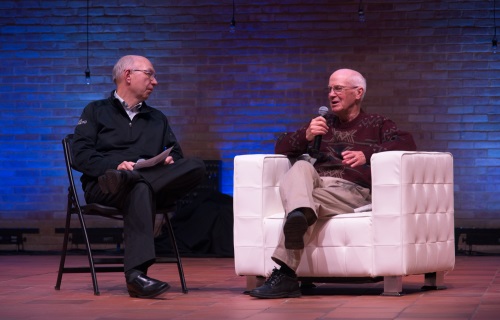 image of President and CEO Dan Lindh with Ray Hunder on stage at staff retreat