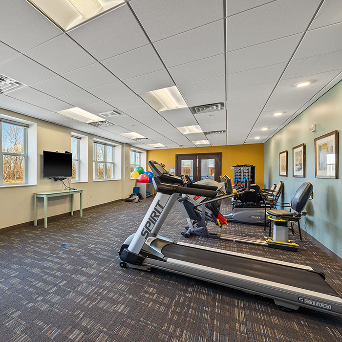 Fitness center with treadmills and recumbent bikes.