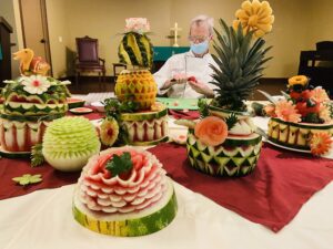 Vibrant fruit carvings by Chef Ken.