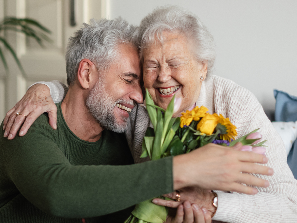 image of older man and woman hugging