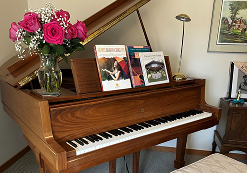 image of June's beloved baby grand piano