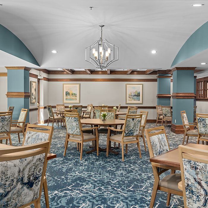 Dining room with tables and chairs.